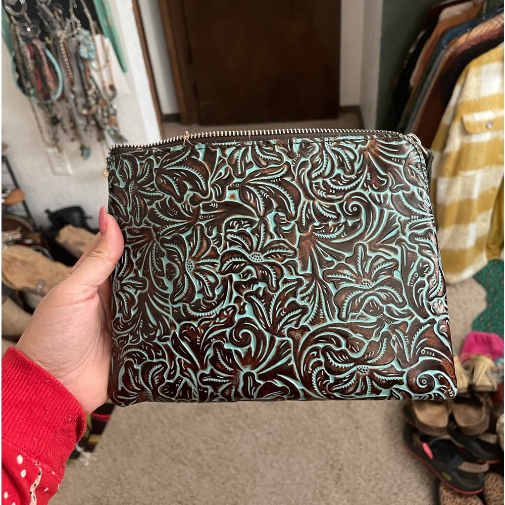 Tooled leather clutch